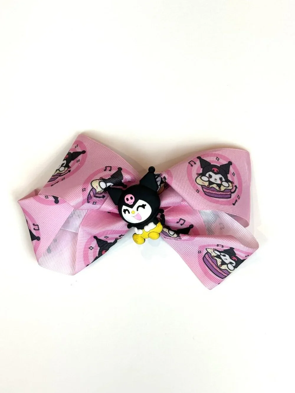 Cute pink Sanrio hair bow featuring Kuromi and an all-over Kuromi pattern. New
